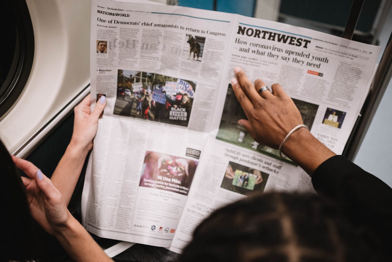 Person holding and reading a new paper